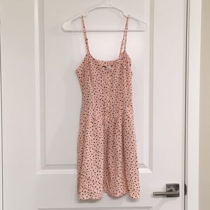 Light pink dress with black hearts.